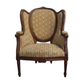 Fauteuil bergère médaillon Louis XVI en noyer tissus en petit point de croix