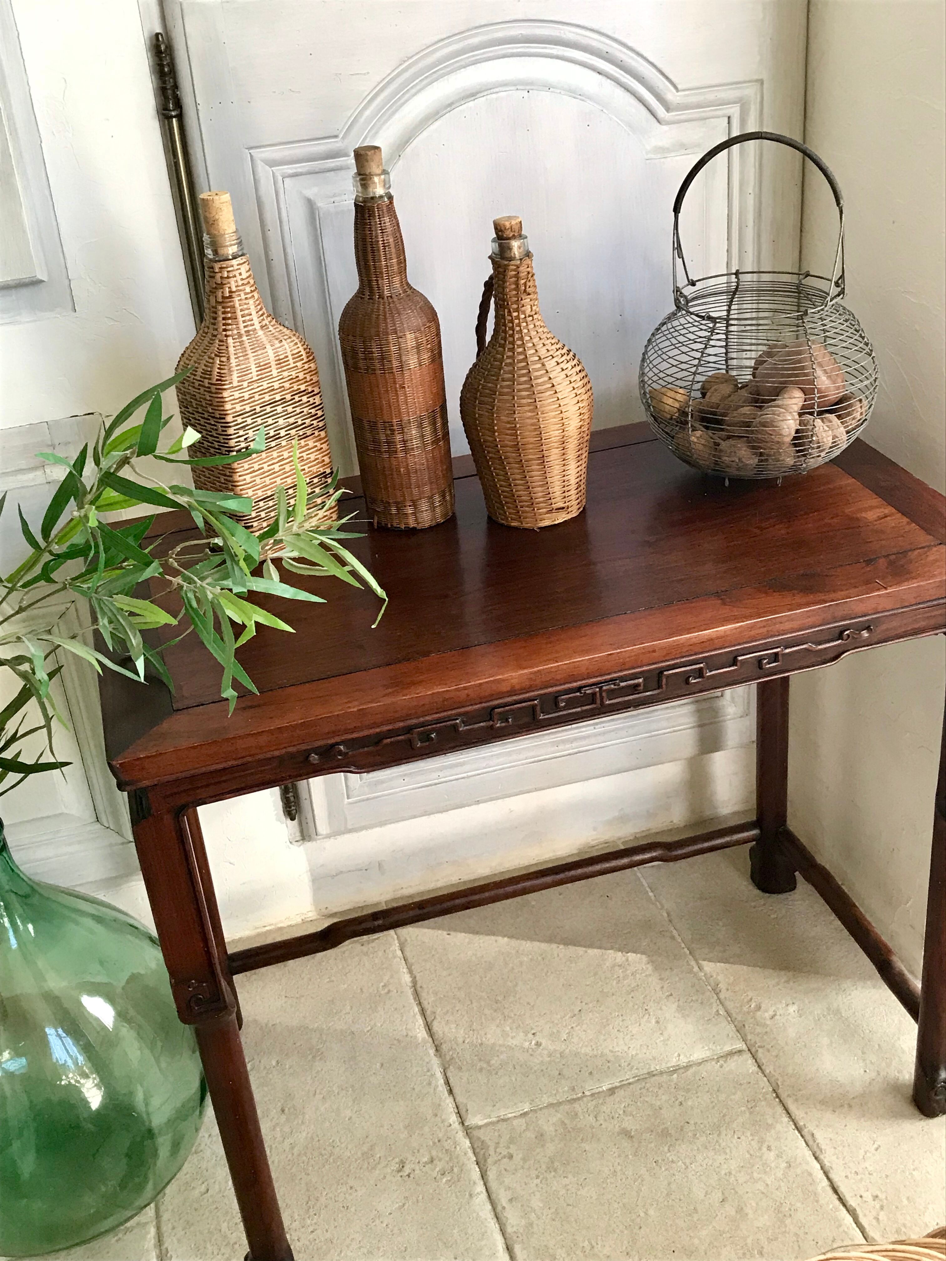 Set of three vintage rattan bottles
