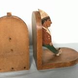 Old wooden bookends with painted characters