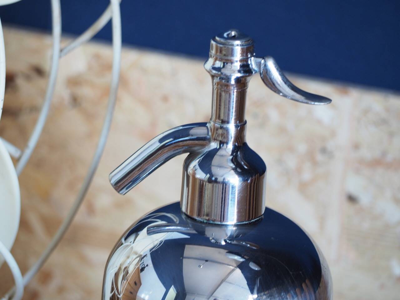 Silver metal siphon.