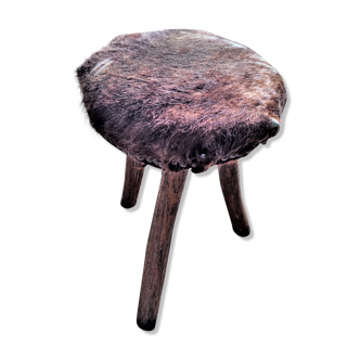 Rustic tripod stool seat covered with goatskin