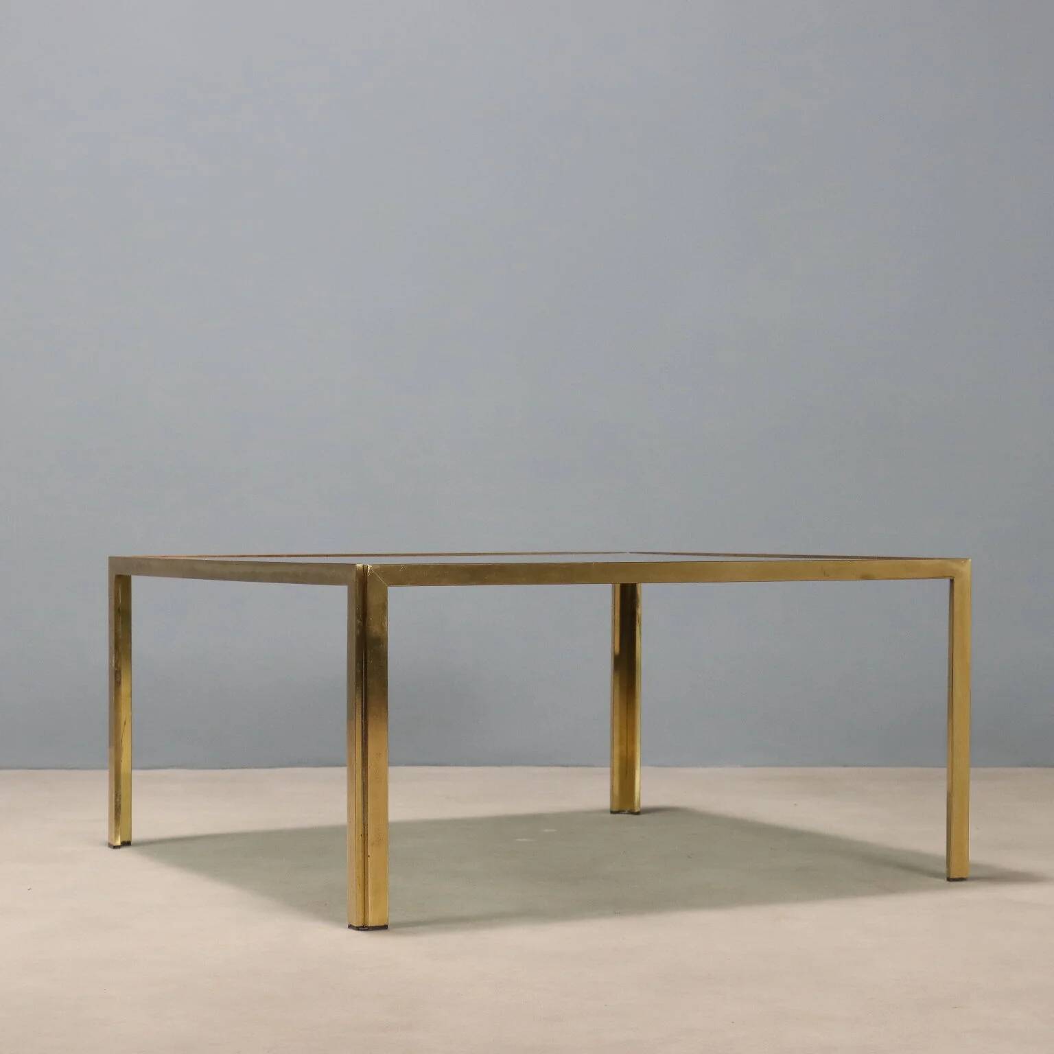 Vintage coffee table in brass and smoked glass, 1970s design.
