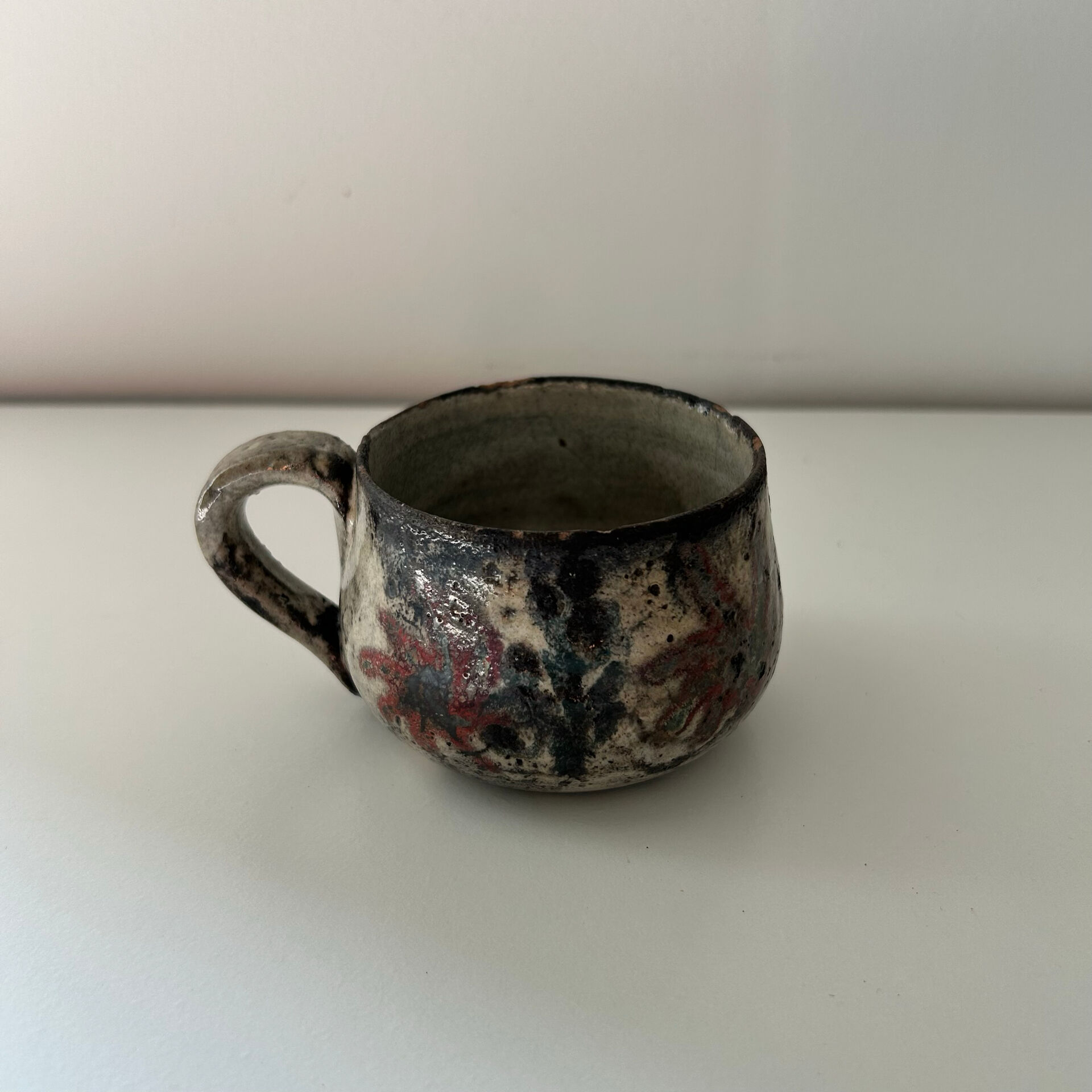 Handcrafted mug with floral decoration