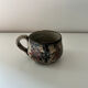 Handcrafted mug with floral decoration