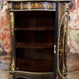 Boulle furniture with a curved shape from the Napoleonic III era in lacquered wood and marquetry.