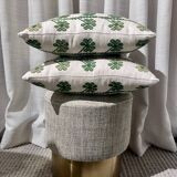 Custom cushions with green clover patterns.