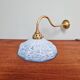 Brass and blue speckled glass wall light