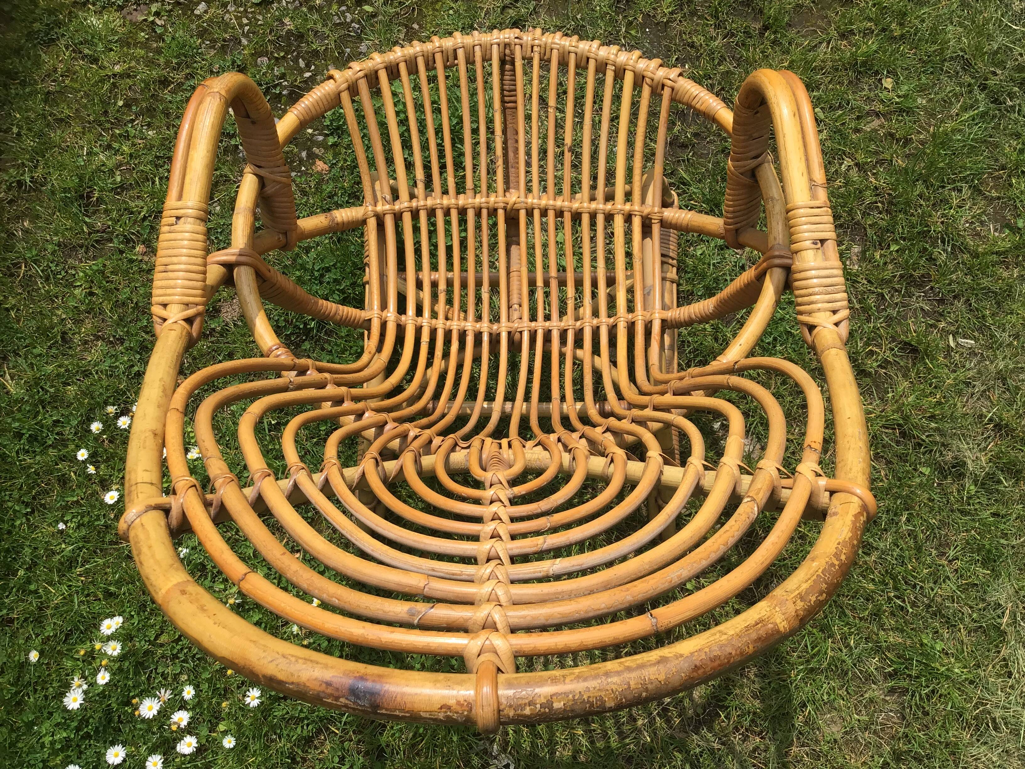 Vintage ovoid-shaped rattan armchair.