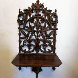 Carved wooden wall shelf