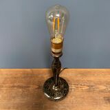 Black table lamp with paint splatters from the 1920s