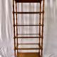 Classic wooden shelves, glass tops and cannage