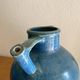 Old oriole in speckled blue glazed stoneware, south-west.