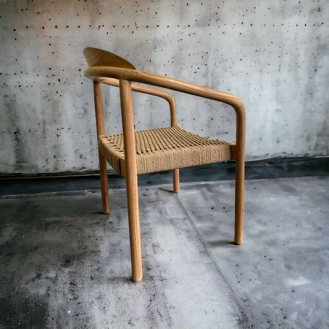 Solid wood chair with woven seat and armrests