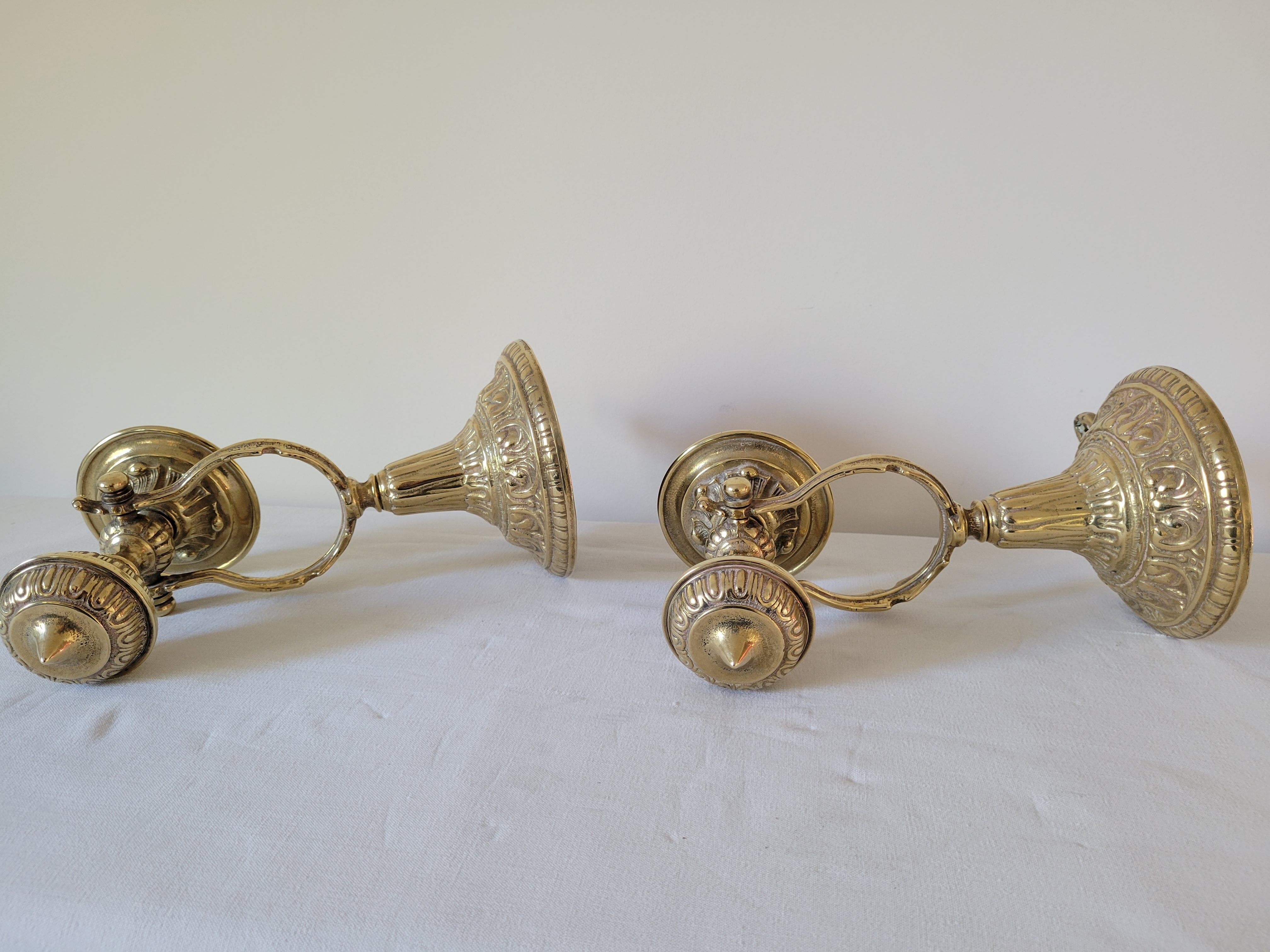Duo of brass balance wall candle holders