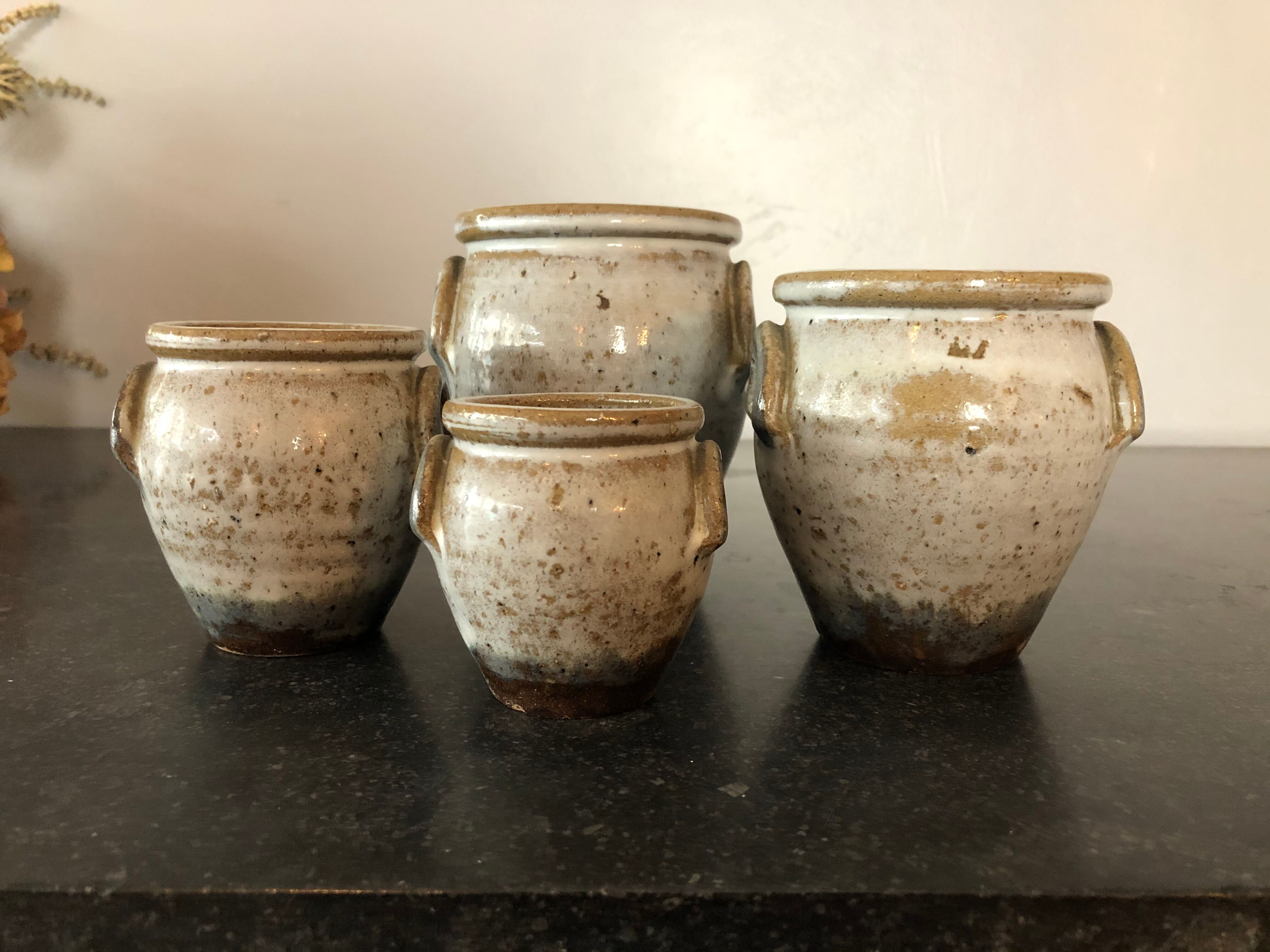 Set of 4 enamelled sandstone pots