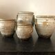 Set of 4 enamelled sandstone pots