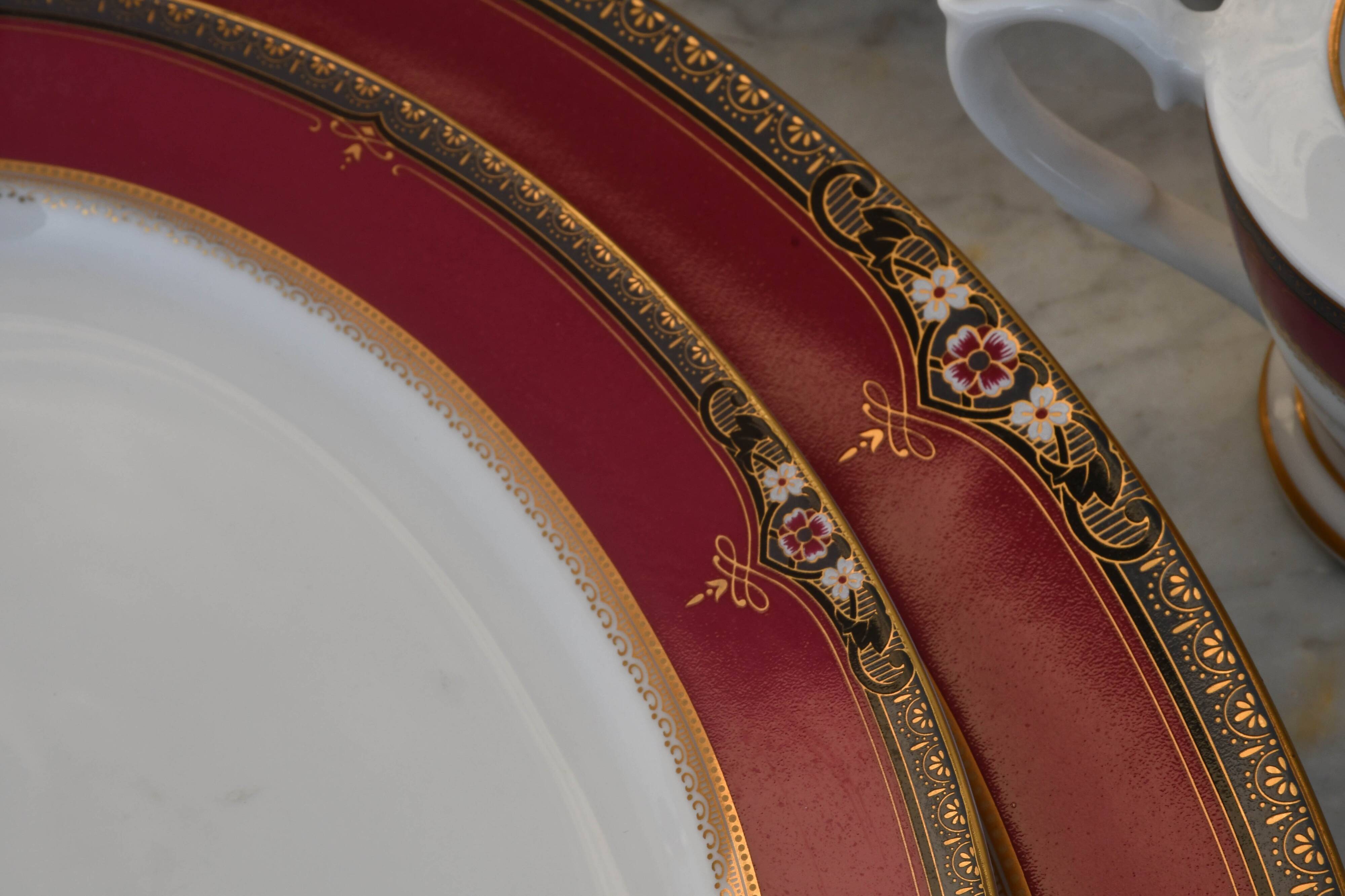 Elegant mid-century Japanese bone china service for 12 in white and noble red