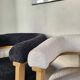 Contemporary armchair in wood and white bouclé fabric