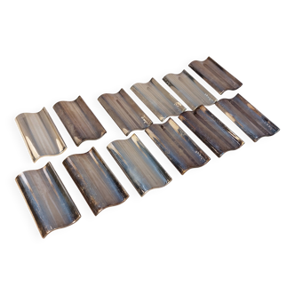 Set of 12 modernist knife rests by Ravinet Denfert.