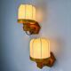 Pair of articulated "Cocoon" wall lights, resin and pine, Italy, circa 1970