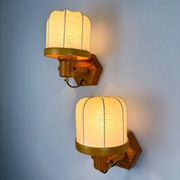 Pair of articulated "Cocoon" wall lights, resin and pine, Italy, circa 1970