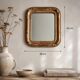 Miroir Louis-Philippe en bois et stuc doré à décor floral, XIXe,  43x38 cm