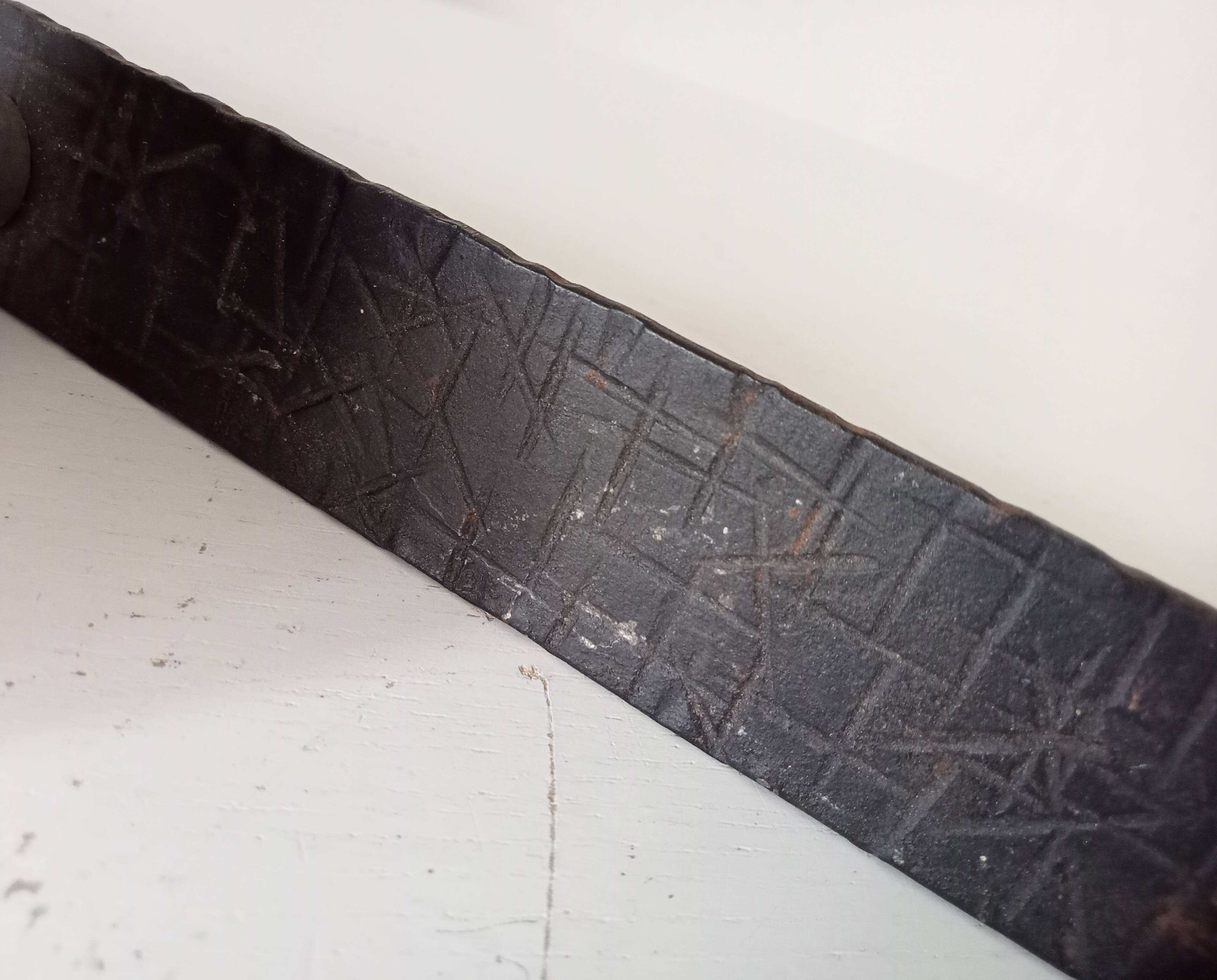 Vintage 1950s wall coat rack, wrought iron with chiselled details and solid aluminium.
