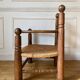 Straw and turned wood fireplace armchair in the style of Charles Dudouyt