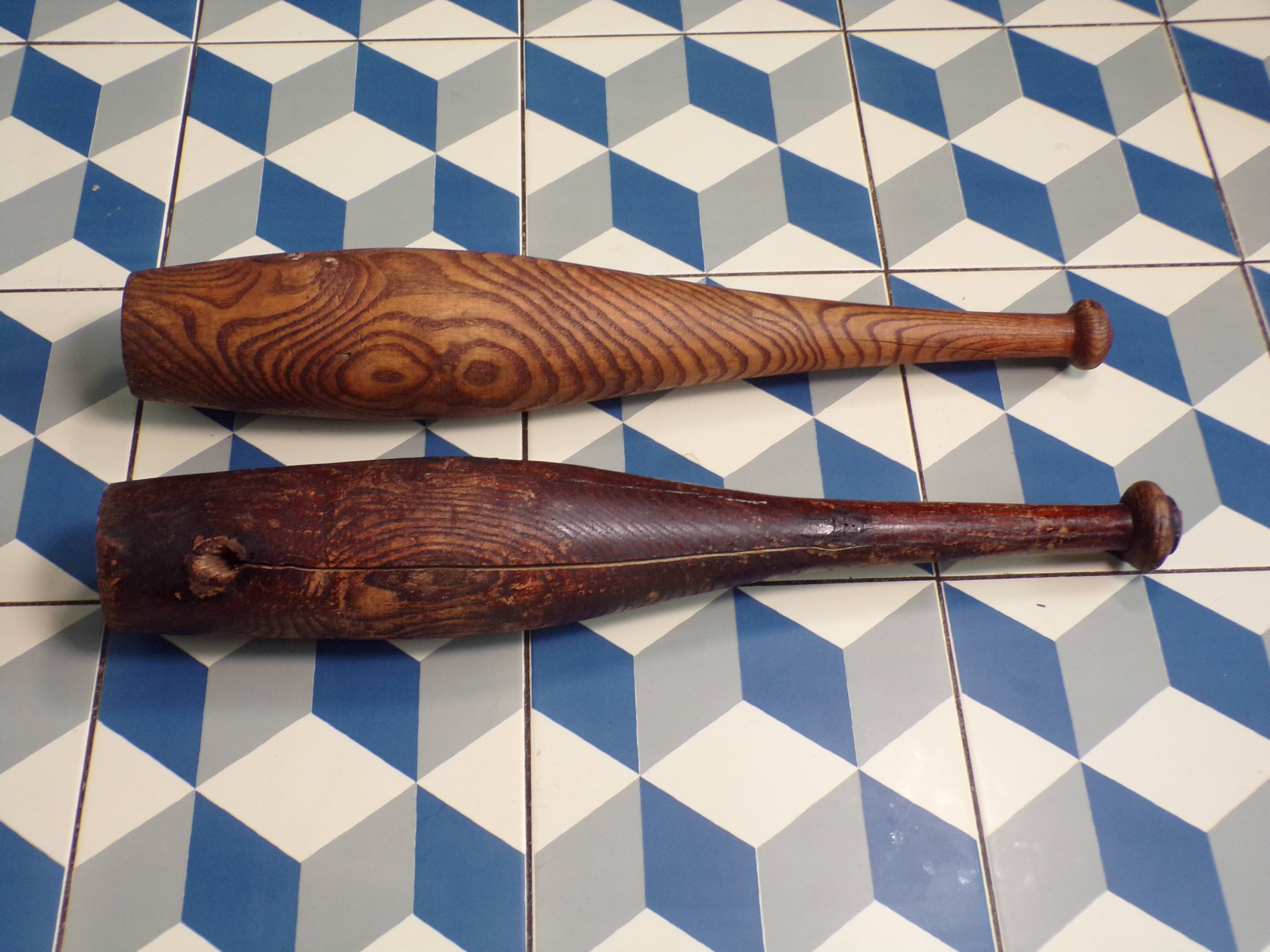 2 old wooden juggling clubs