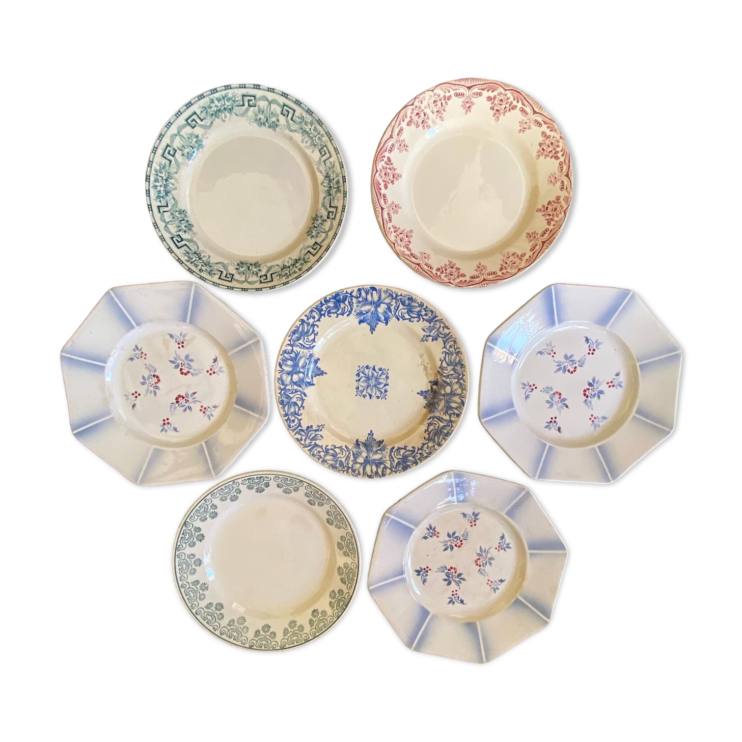 7 matching dessert plates in red green and blue.