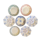 7 matching dessert plates in red green and blue.