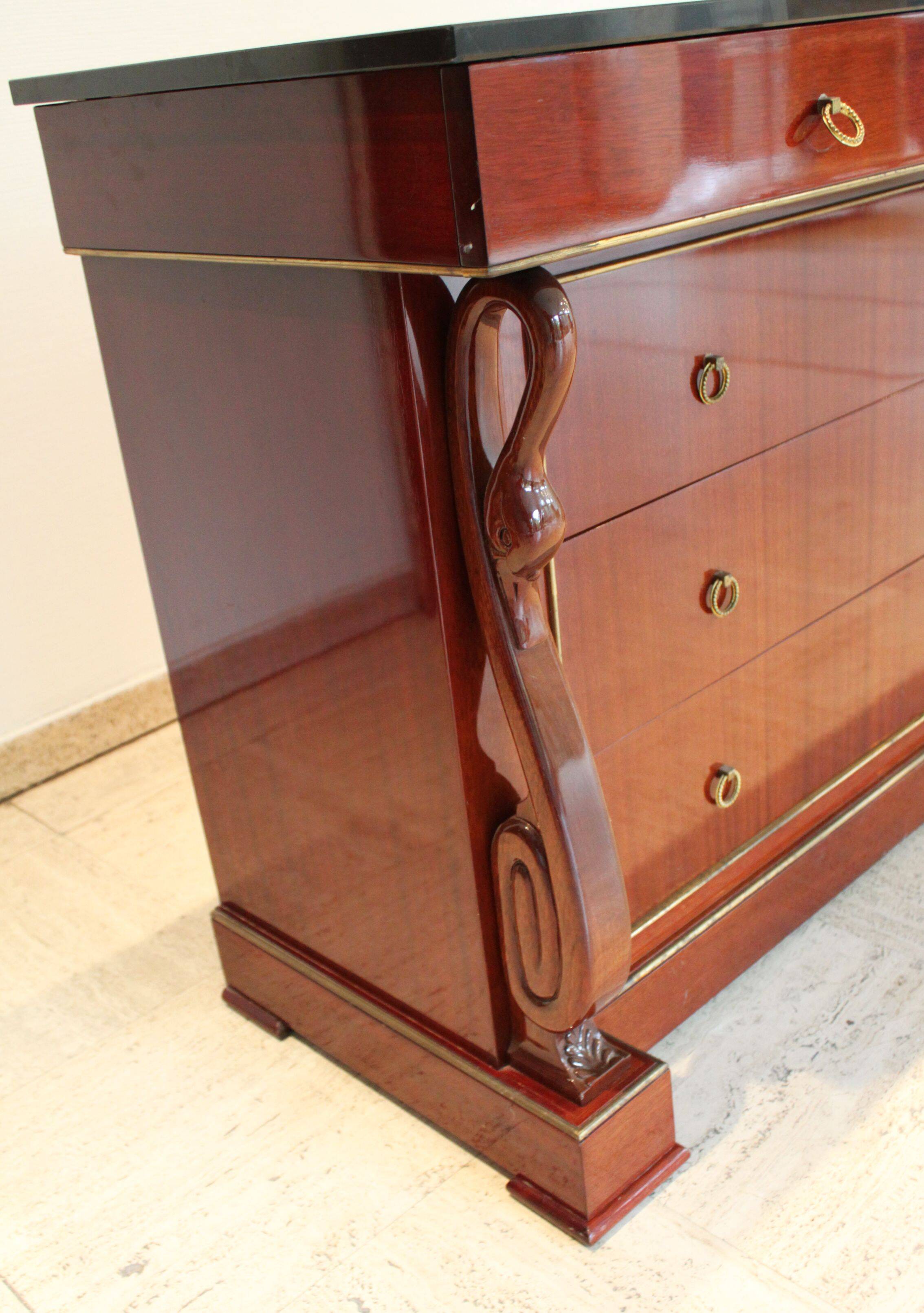 Mahogany “swan neck” chest of drawers, Empire style, 19th century.