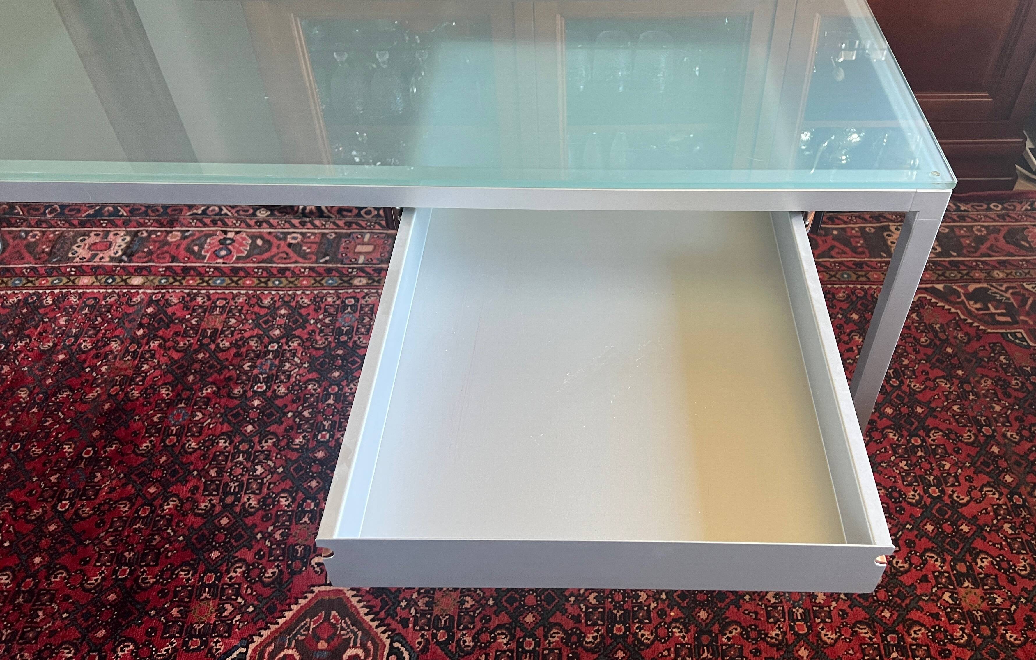 Glass and metal desk with wheels