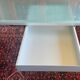 Glass and metal desk with wheels