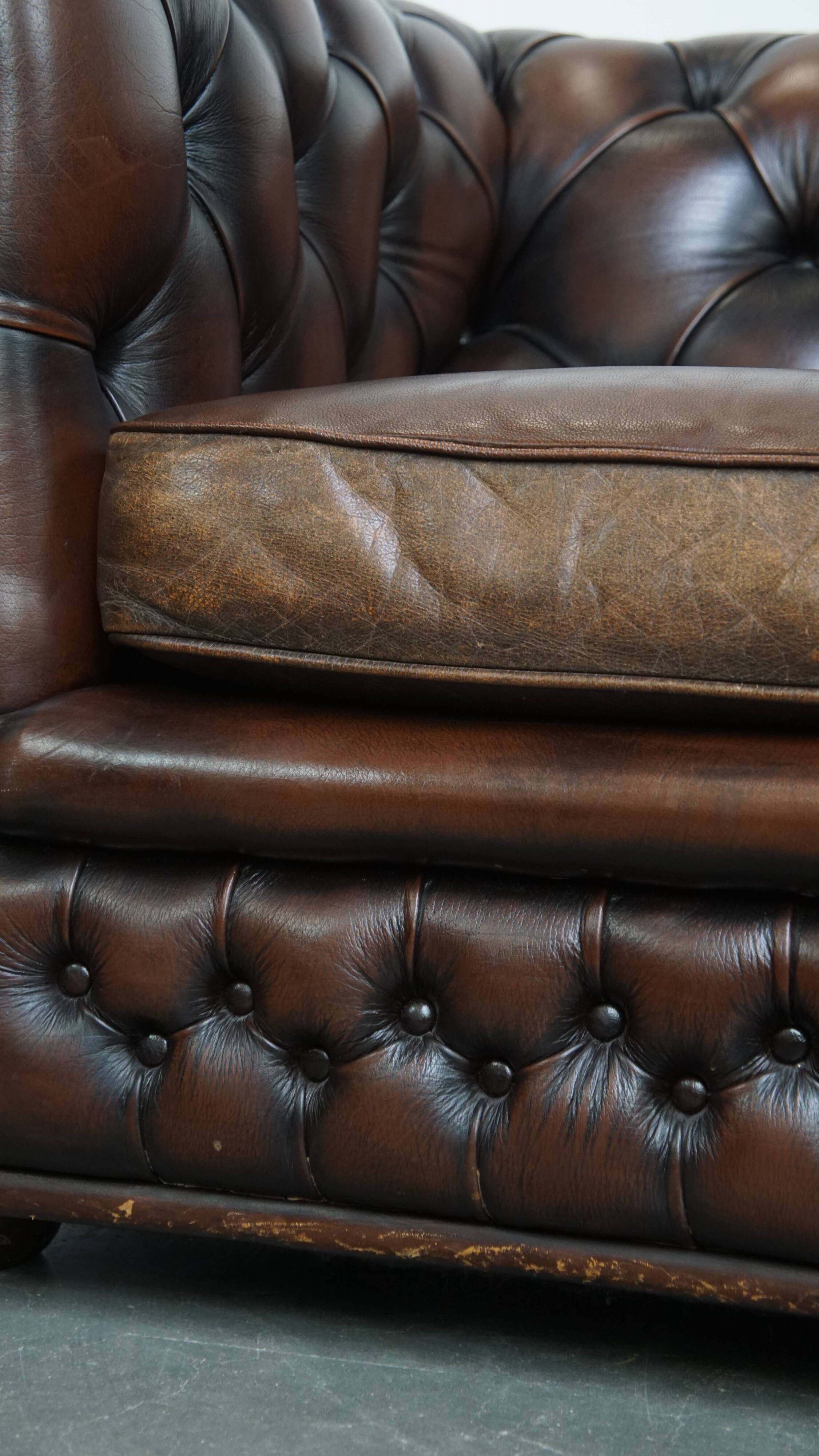 Dark brown English cowhide leather chesterfield armchair