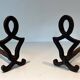 Pair of Modernist Andirons in Cast Iron with Stylised Figure Supports, by Ray