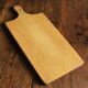 Wooden cutting board with handle