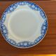 Antique compote dish with blue floral decoration.