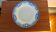 Antique compote dish with blue floral decoration.