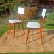 vintage wooden chairs with white faux leather