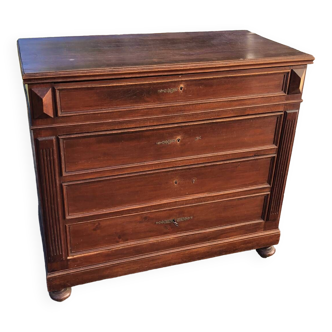 Solid wood chest of drawers with sculpture