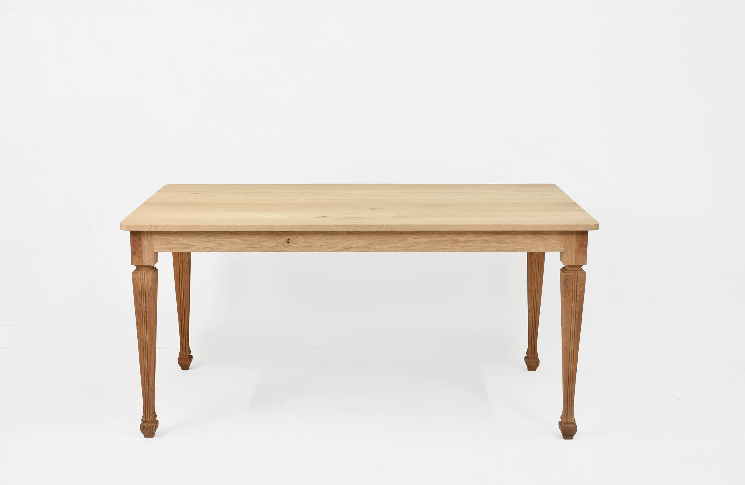 Vintage solid oak table with antique legs.
