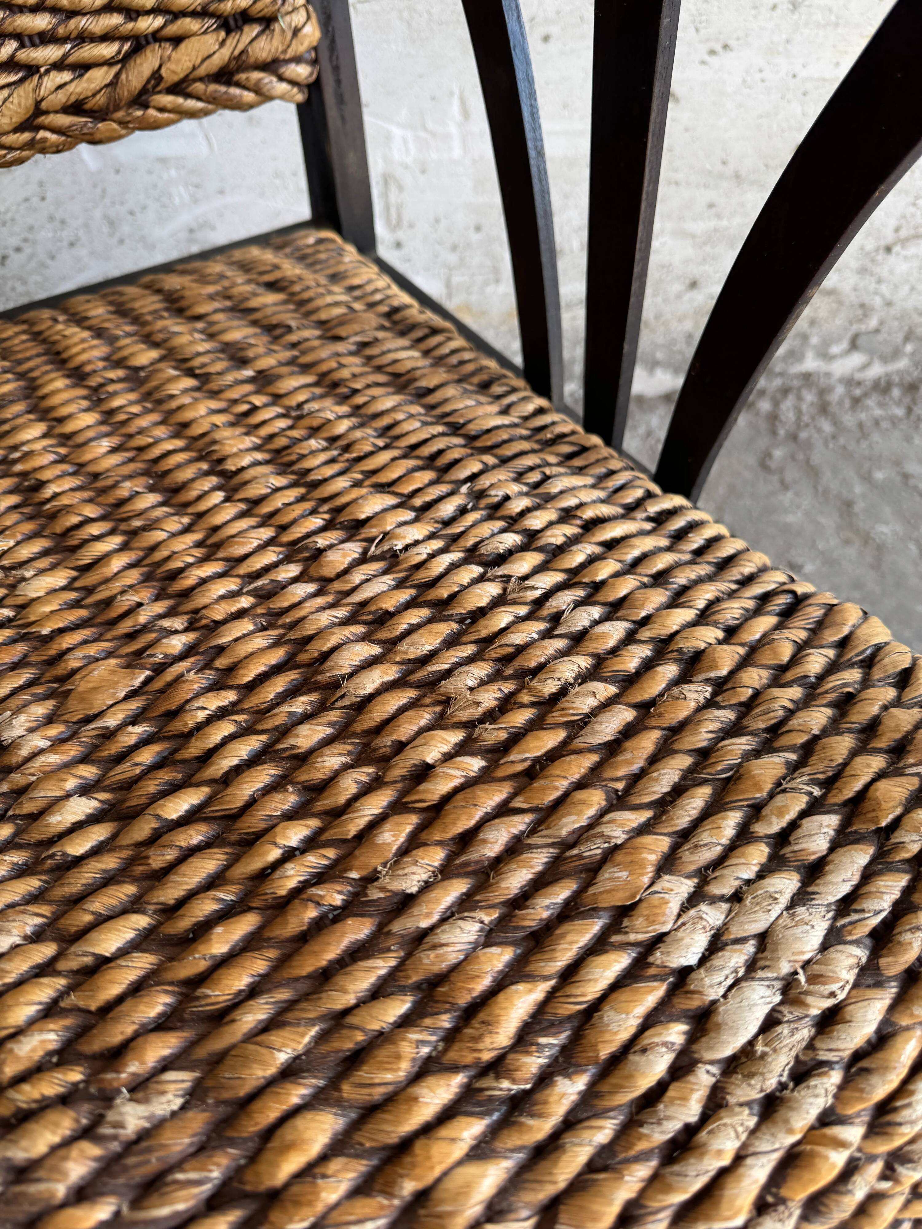 Set of two colonial dark-brown wooden armchairs with natural rattan seating (pair)