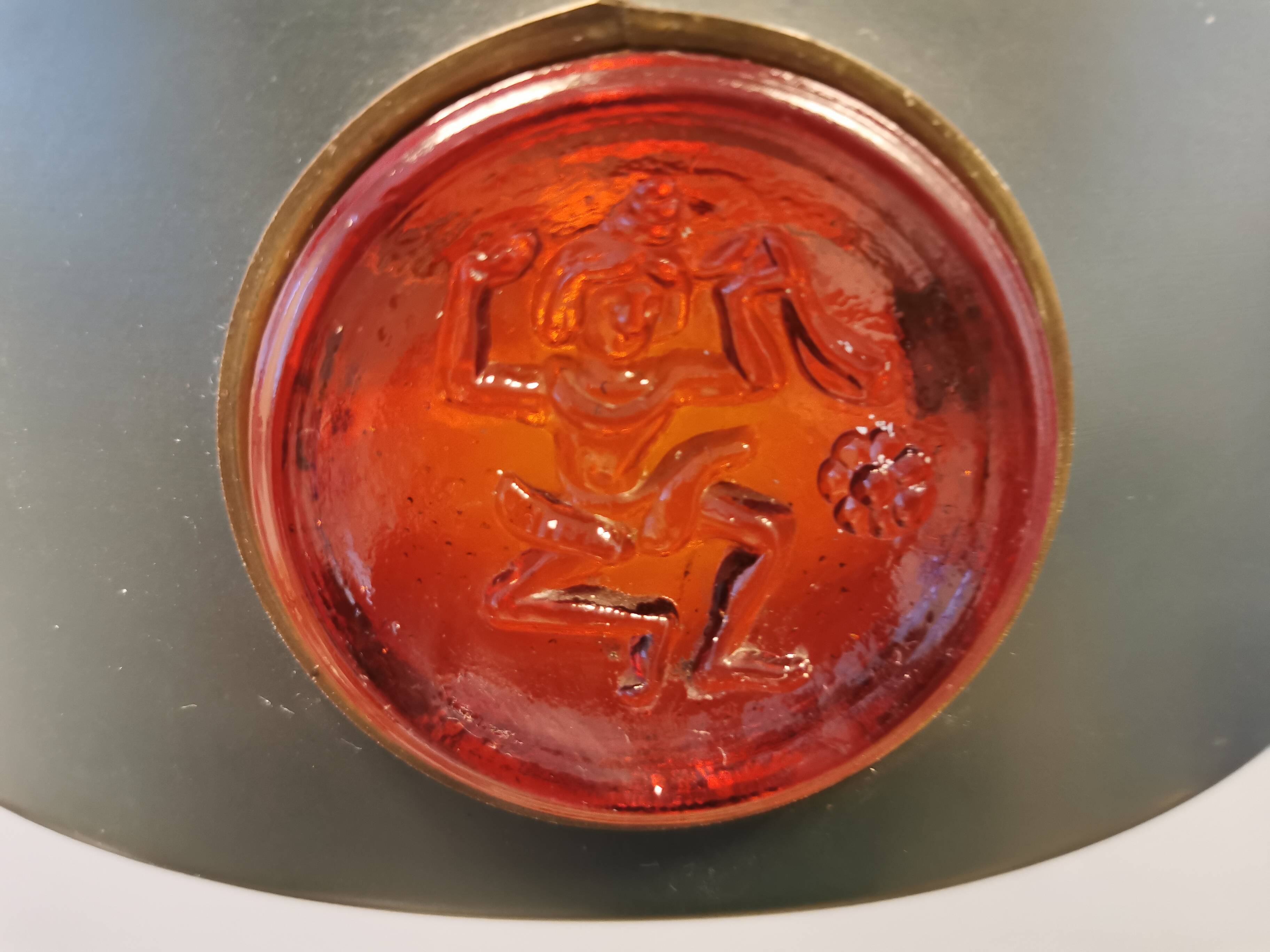 Swedish hanging lamp, in dark green lacquered metal with red glass prisms and brass top/suspension.