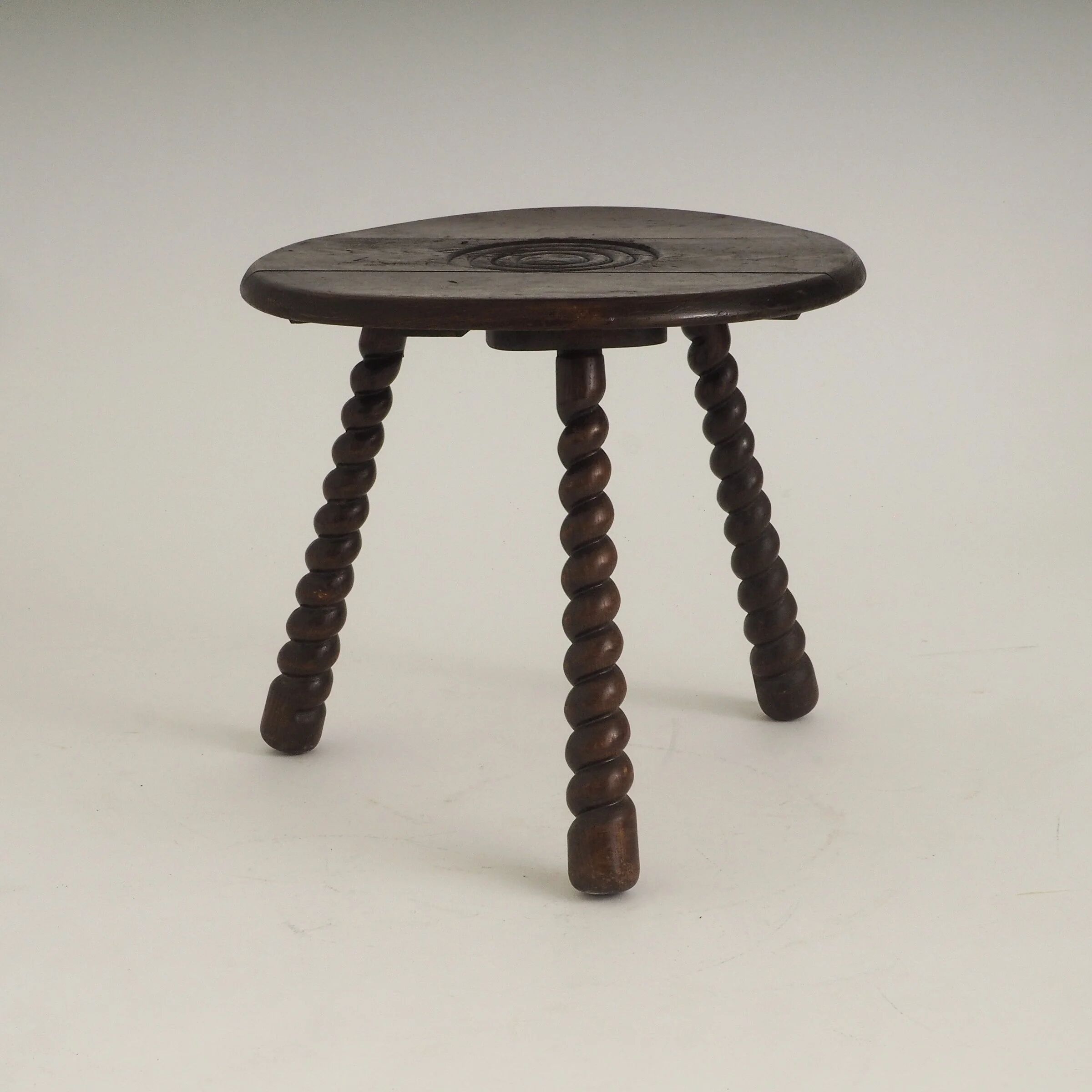 French oak tripod side table attributed to Charles Dudouyt