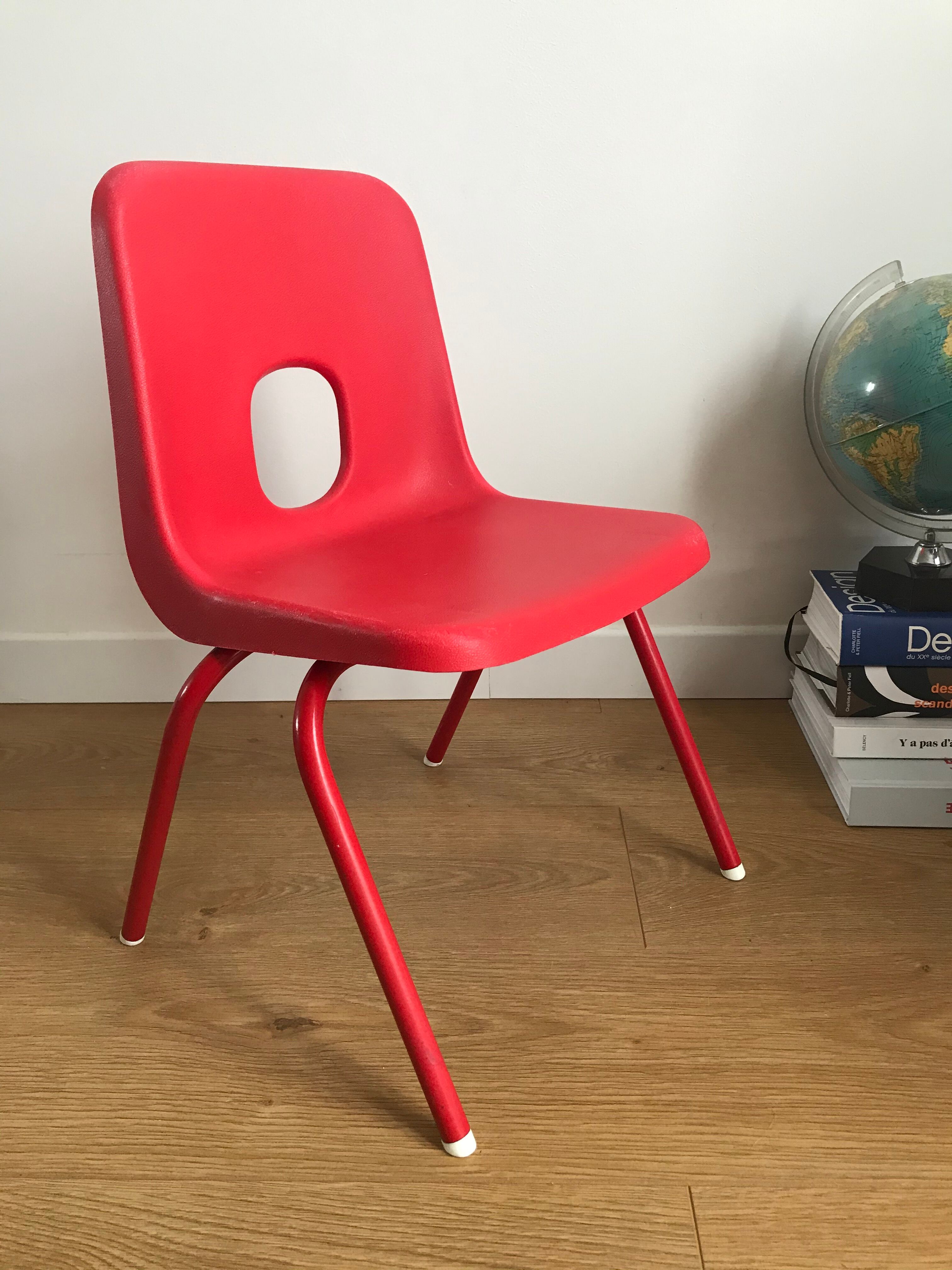 Red child chair by robin day for ikea