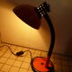 Orange and black arm metal table lamp flexible