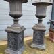 Large antique cast iron vases on pedestal