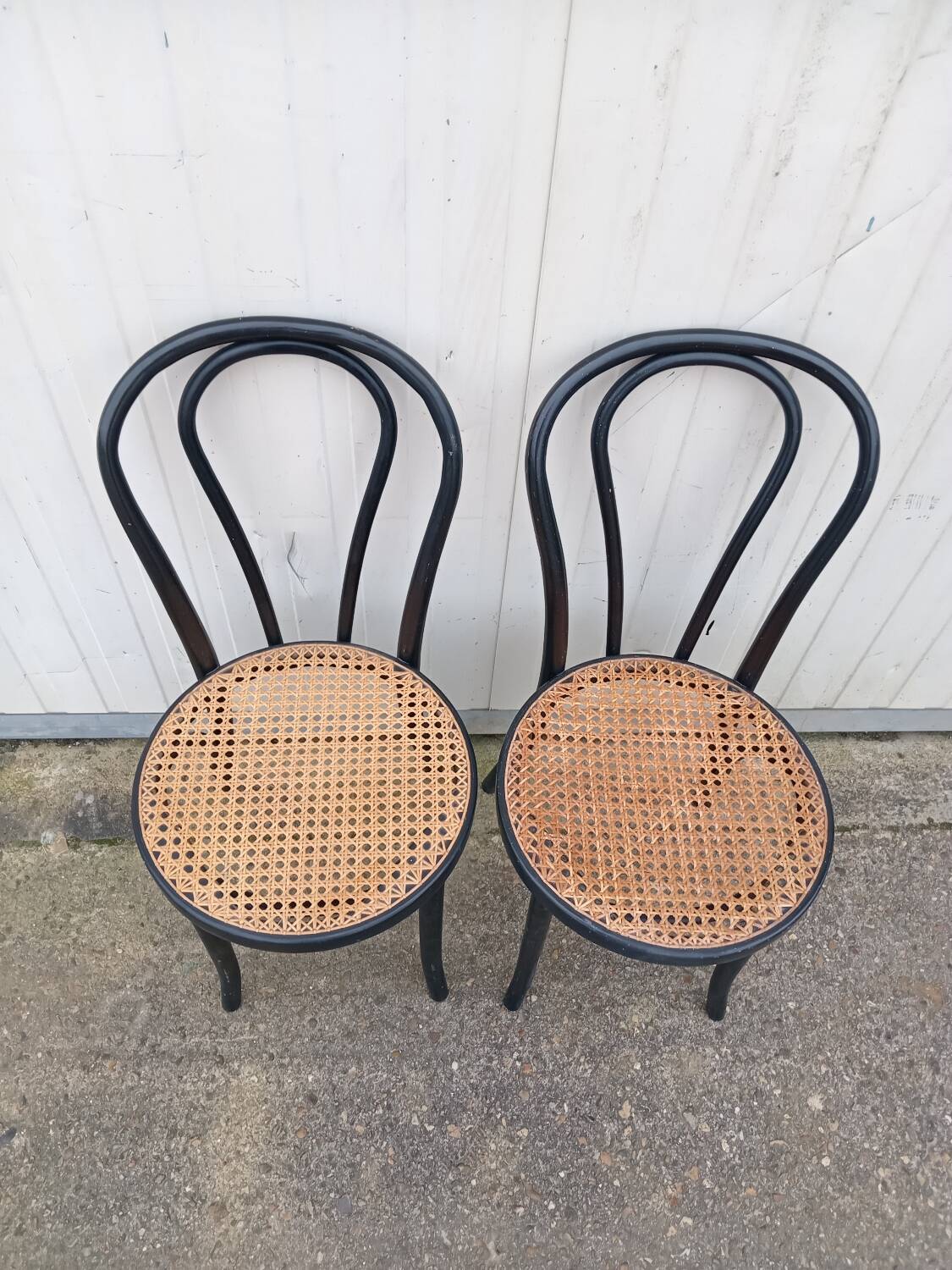 Pair of fmg bentwood and cane bistro chairs