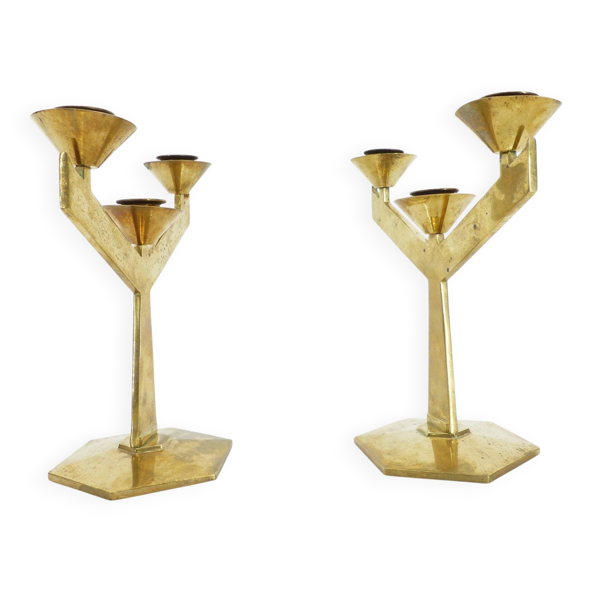 Pair of modernist three-armed solid brass candlesticks, circa 1960